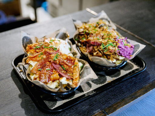 Two poutine dishes prepared by Pou Poutine